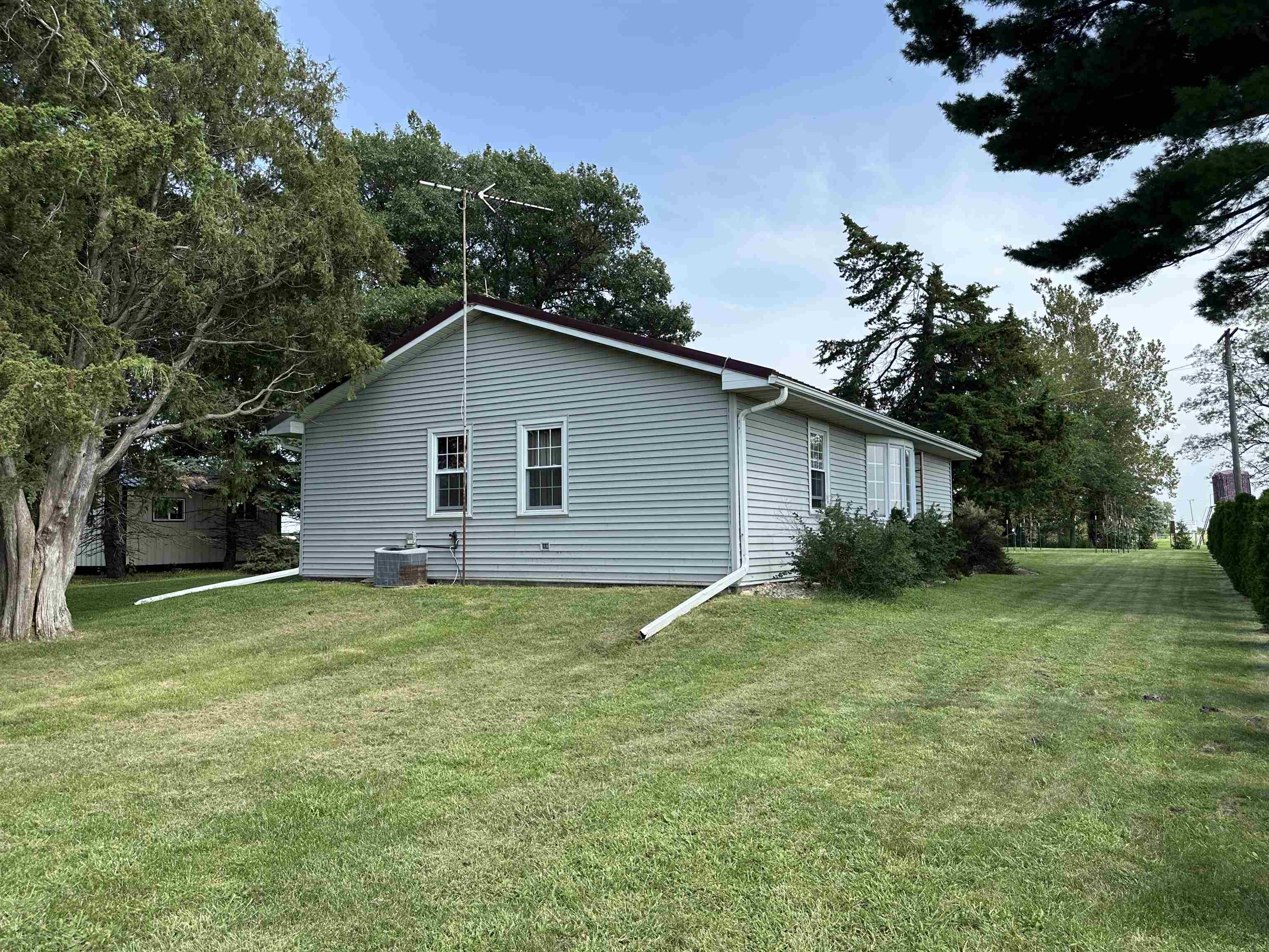 9896 Lincoln Road Morrison, IL 61270 - Photo 19 of 38 a view of a backyard with plants and large trees