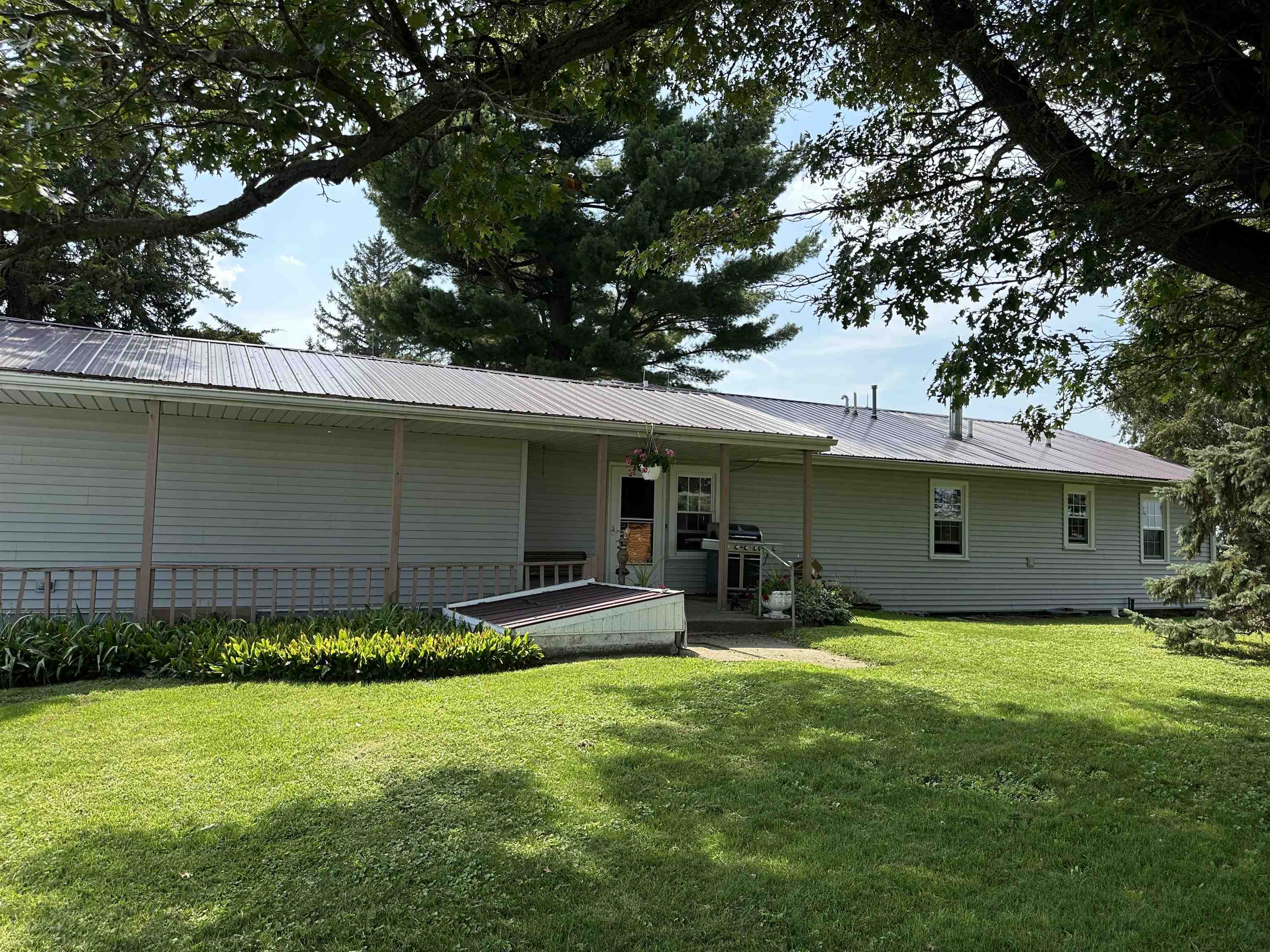 9896 Lincoln Road Morrison, IL 61270 - Photo 2 of 38 a front view of a house with a yard and garage