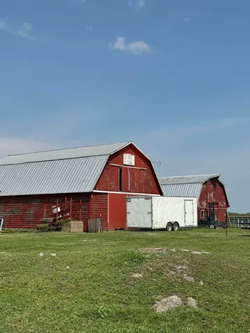 a front view of house with yard and outdoor seating
