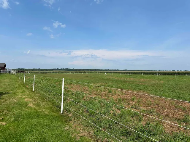 a view of a swimming pool and an outdoor seating