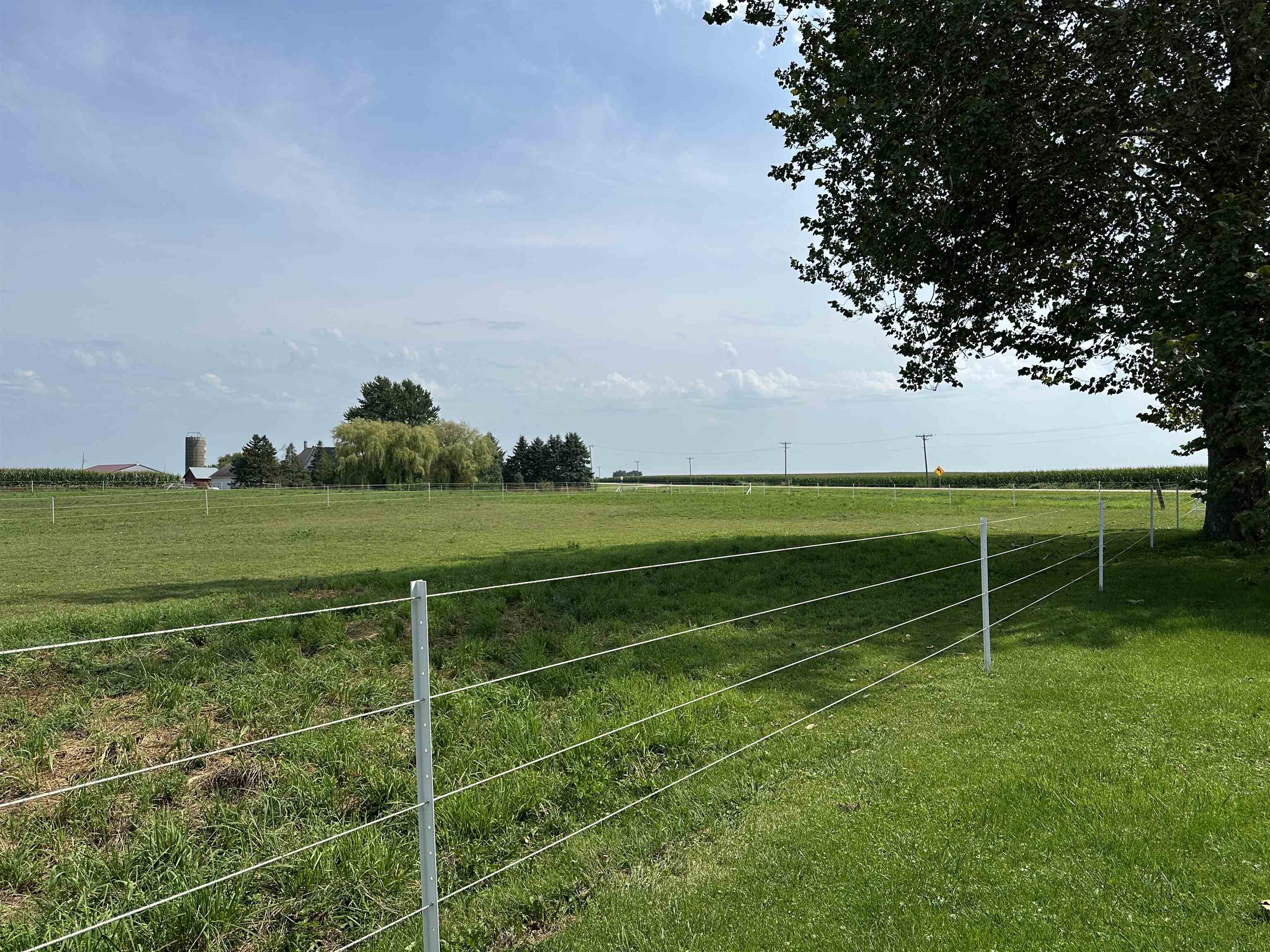 9896 Lincoln Road Morrison, IL 61270 - Photo 5 of 38 a view of a field with grass and trees