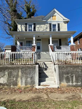 a front view of a house with a porch
