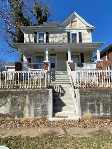 a front view of a house with a porch