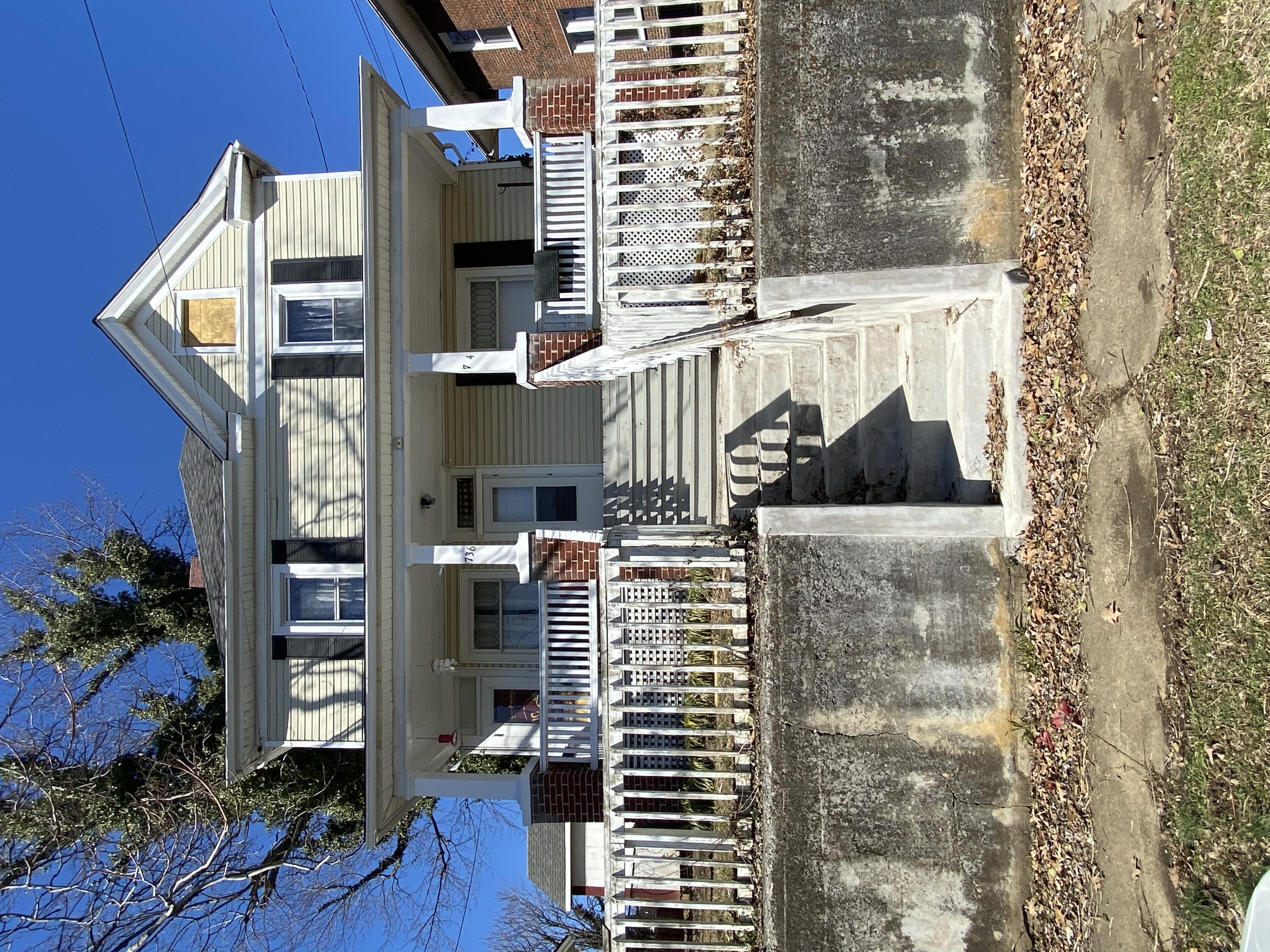 a front view of a house with a porch