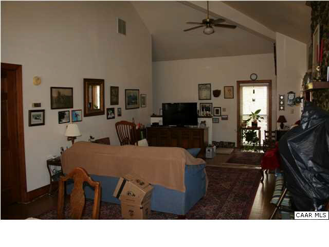 1233 Jacks Shop Road Rochelle, VA 22738 - Photo 16 of 30 a living room with furniture a flat screen tv and a refrigerator