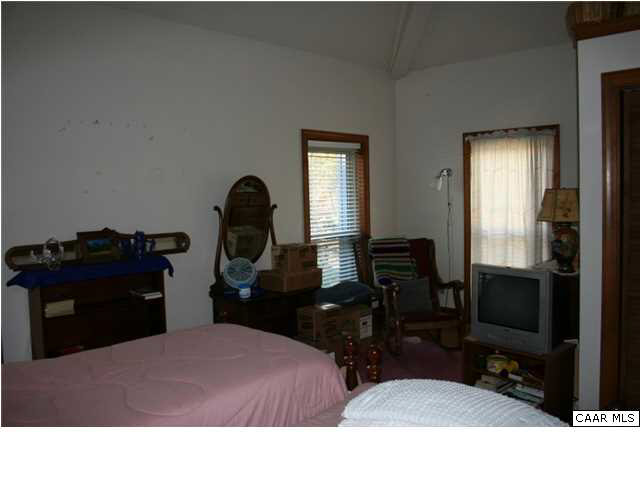 1233 Jacks Shop Road Rochelle, VA 22738 - Photo 22 of 30 a bedroom with a bed and a dresser