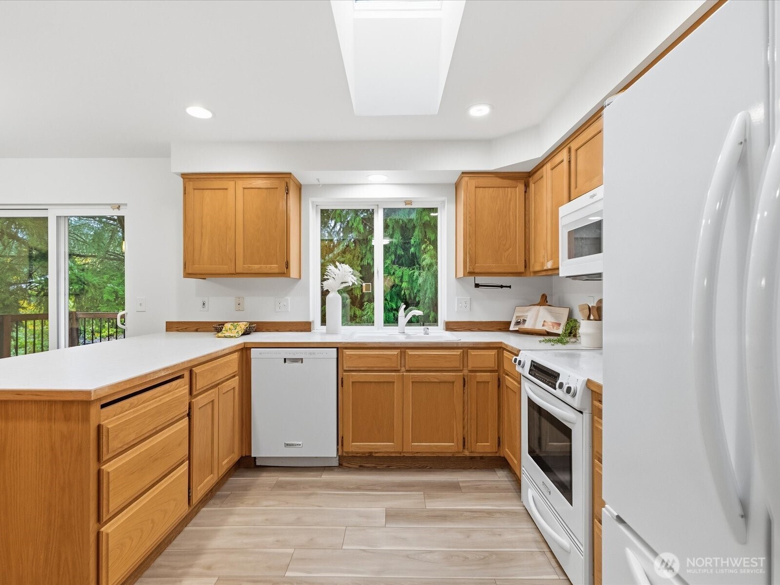 3129 200th Place Southeast Bothell, WA 98012 - Photo 11 of 38 a kitchen with a stove sink and cabinets