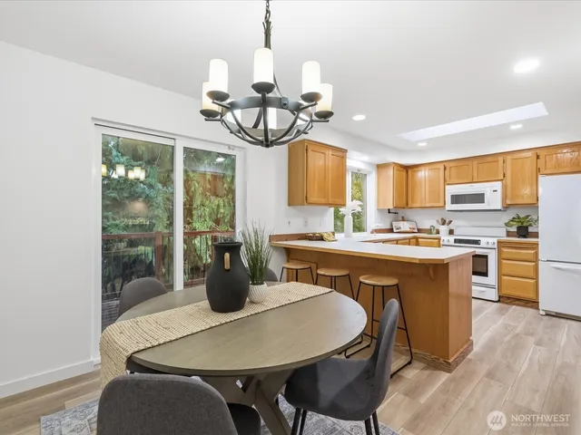 a view of a dining room with furniture window and outside view