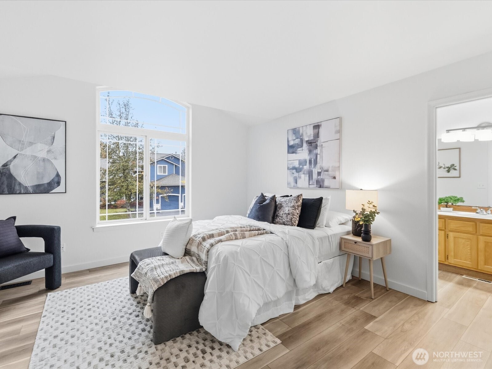 3129 200th Place Southeast Bothell, WA 98012 - Photo 18 of 38 a bedroom with a large bed and a window