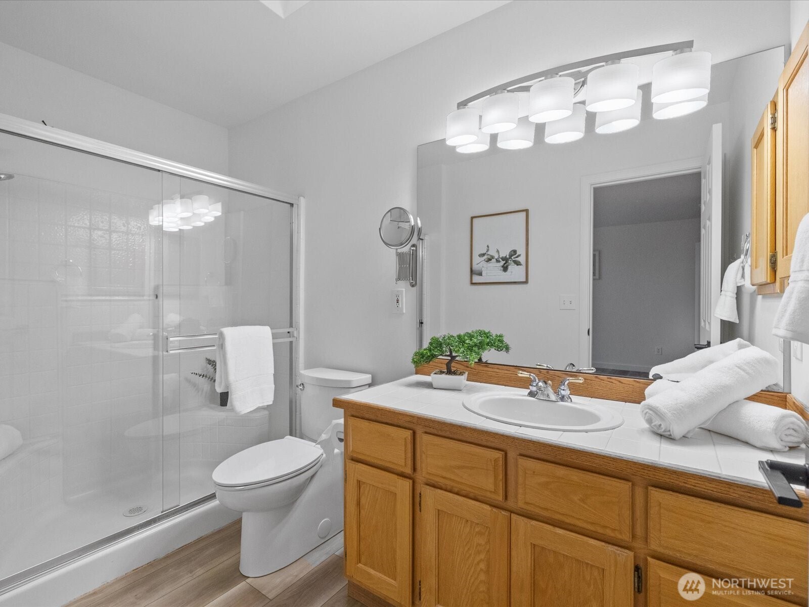 3129 200th Place Southeast Bothell, WA 98012 - Photo 19 of 38 a bathroom with a granite countertop sink mirror vanity and toilet
