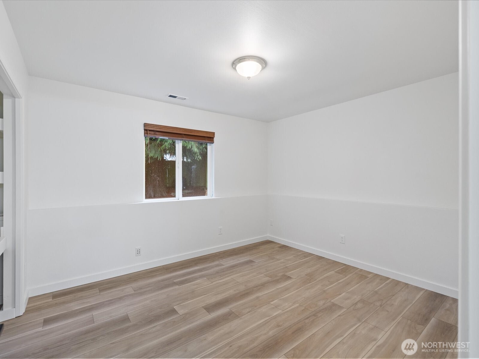 3129 200th Place Southeast Bothell, WA 98012 - Photo 27 of 38 an empty room with wooden floor and windows