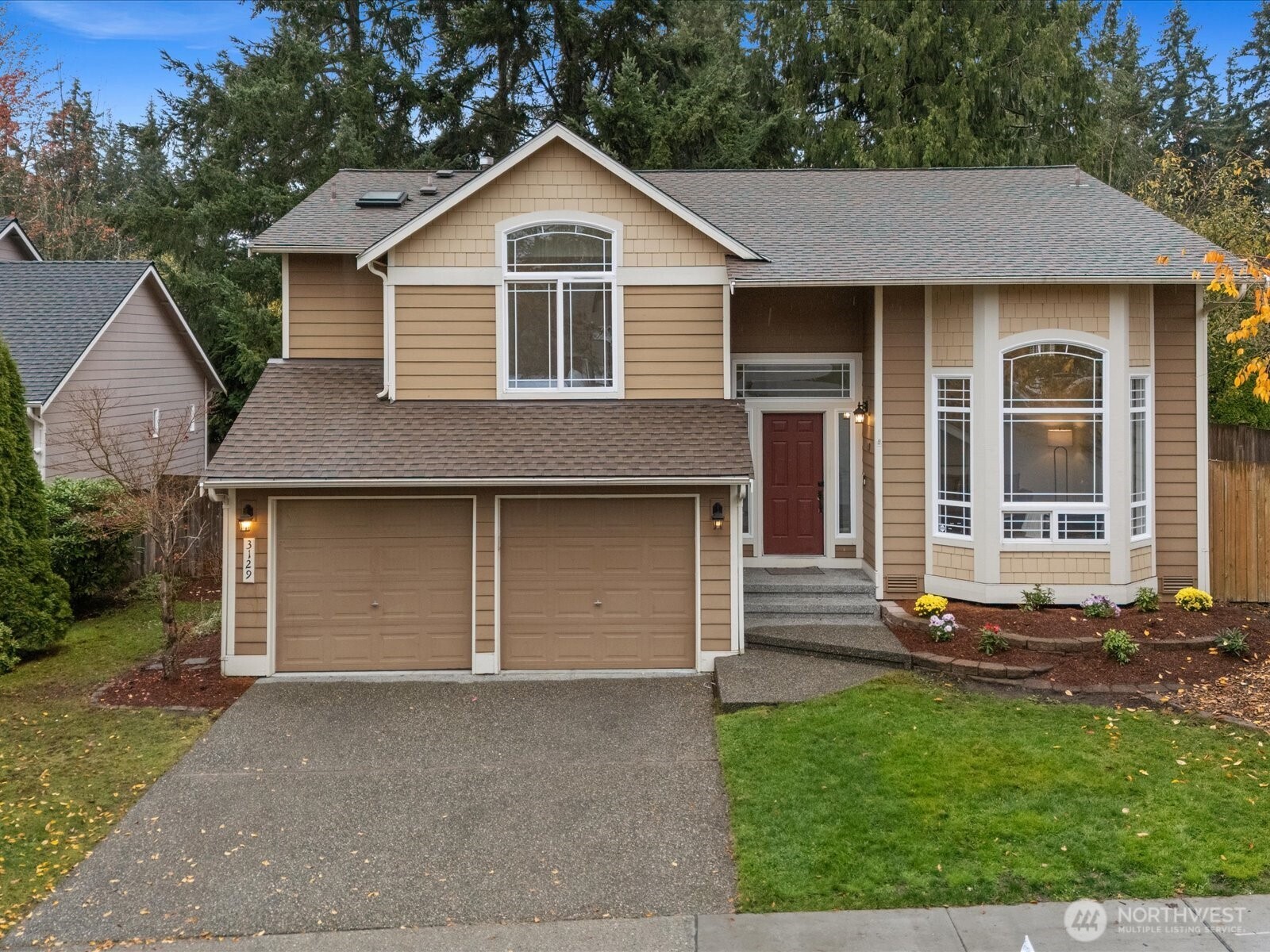 3129 200th Place Southeast Bothell, WA 98012 - Photo 38 of 38 a front view of a house with a yard