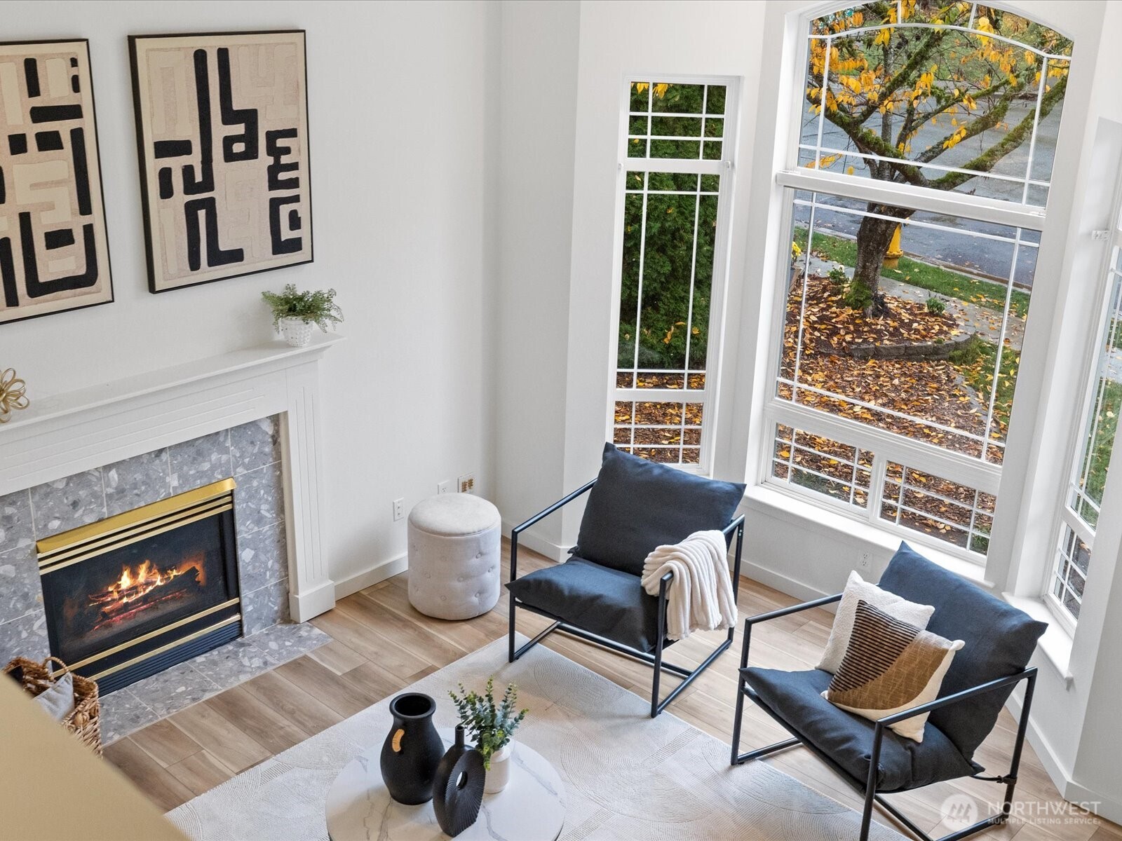 3129 200th Place Southeast Bothell, WA 98012 - Photo 7 of 38 a living room with furniture a fireplace and a window