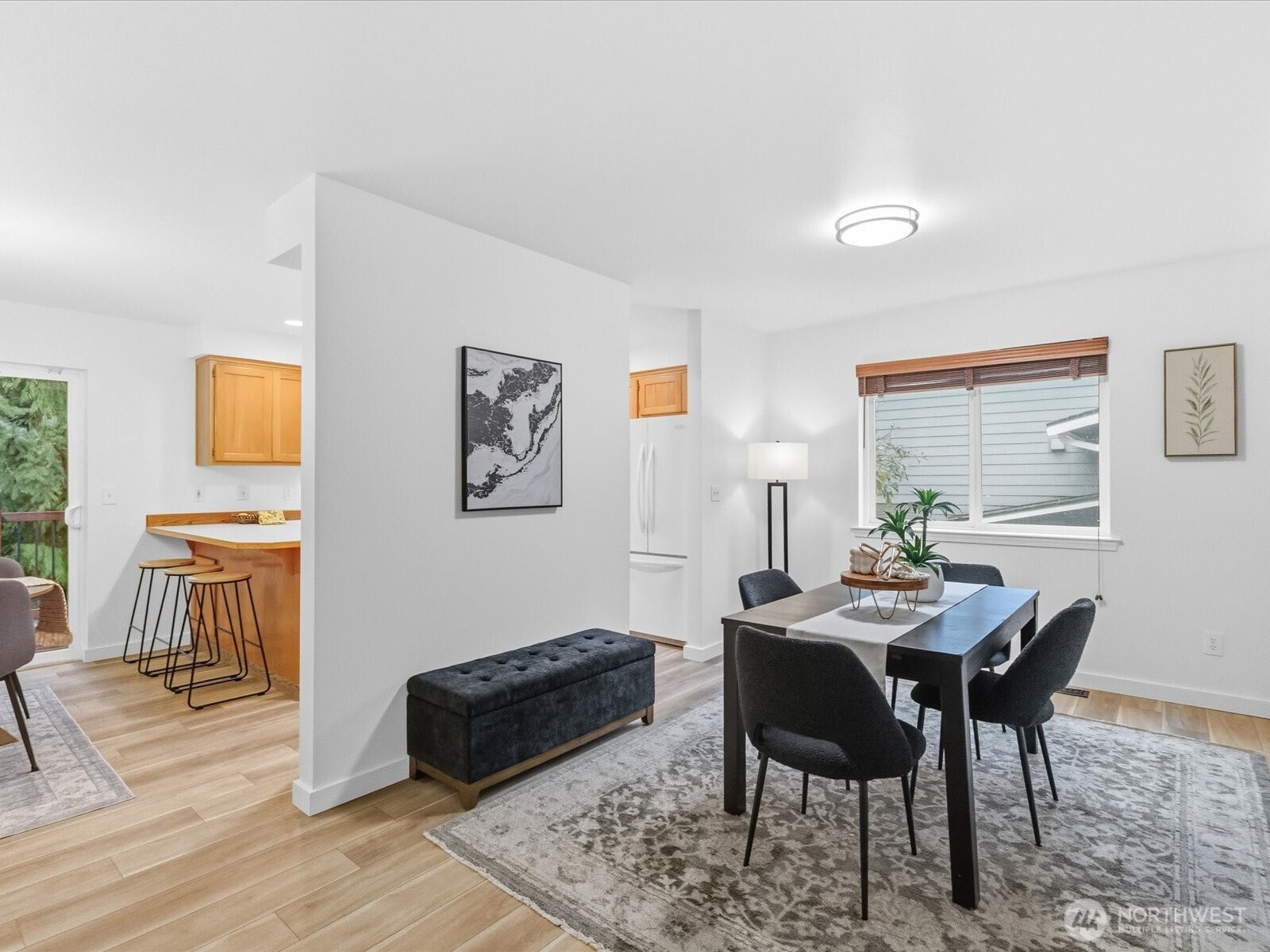 3129 200th Place Southeast Bothell, WA 98012 - Photo 9 of 38 a dining room with furniture and wooden floor