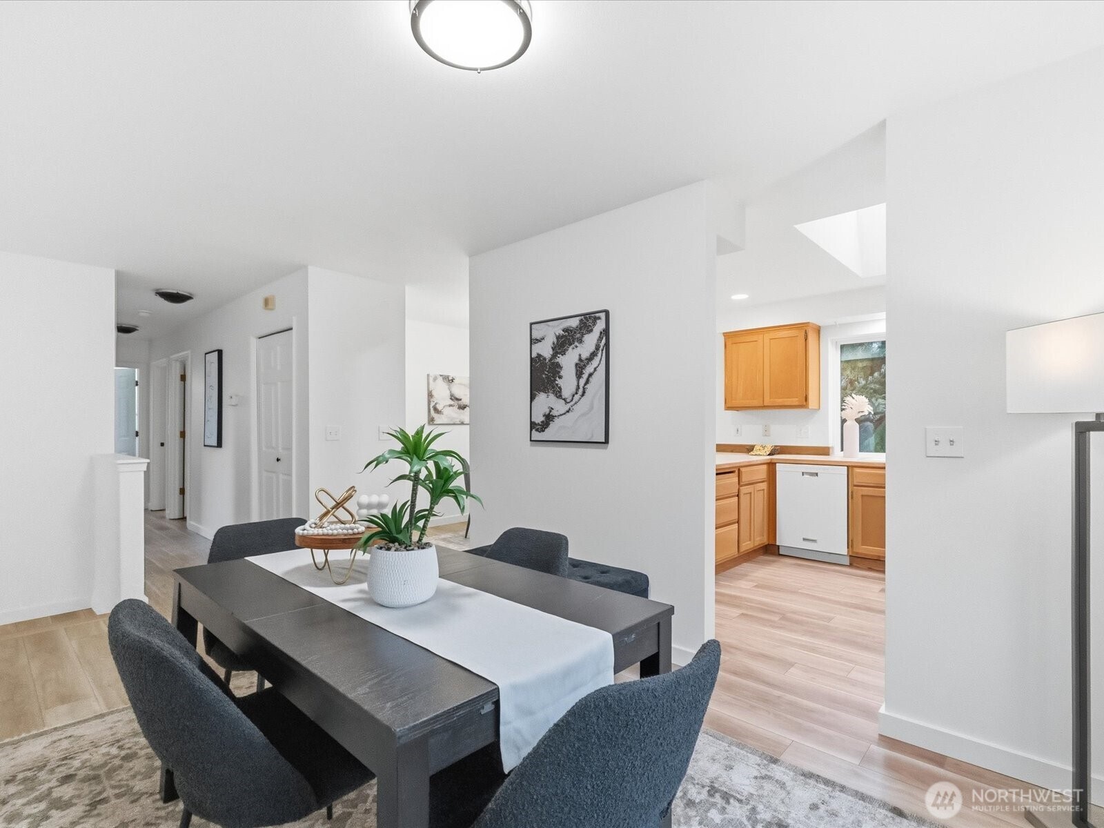 3129 200th Place Southeast Bothell, WA 98012 - Photo 10 of 38 a view of a dining room with furniture and wooden floor