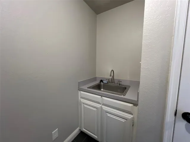 a bathroom with a sink and vanity