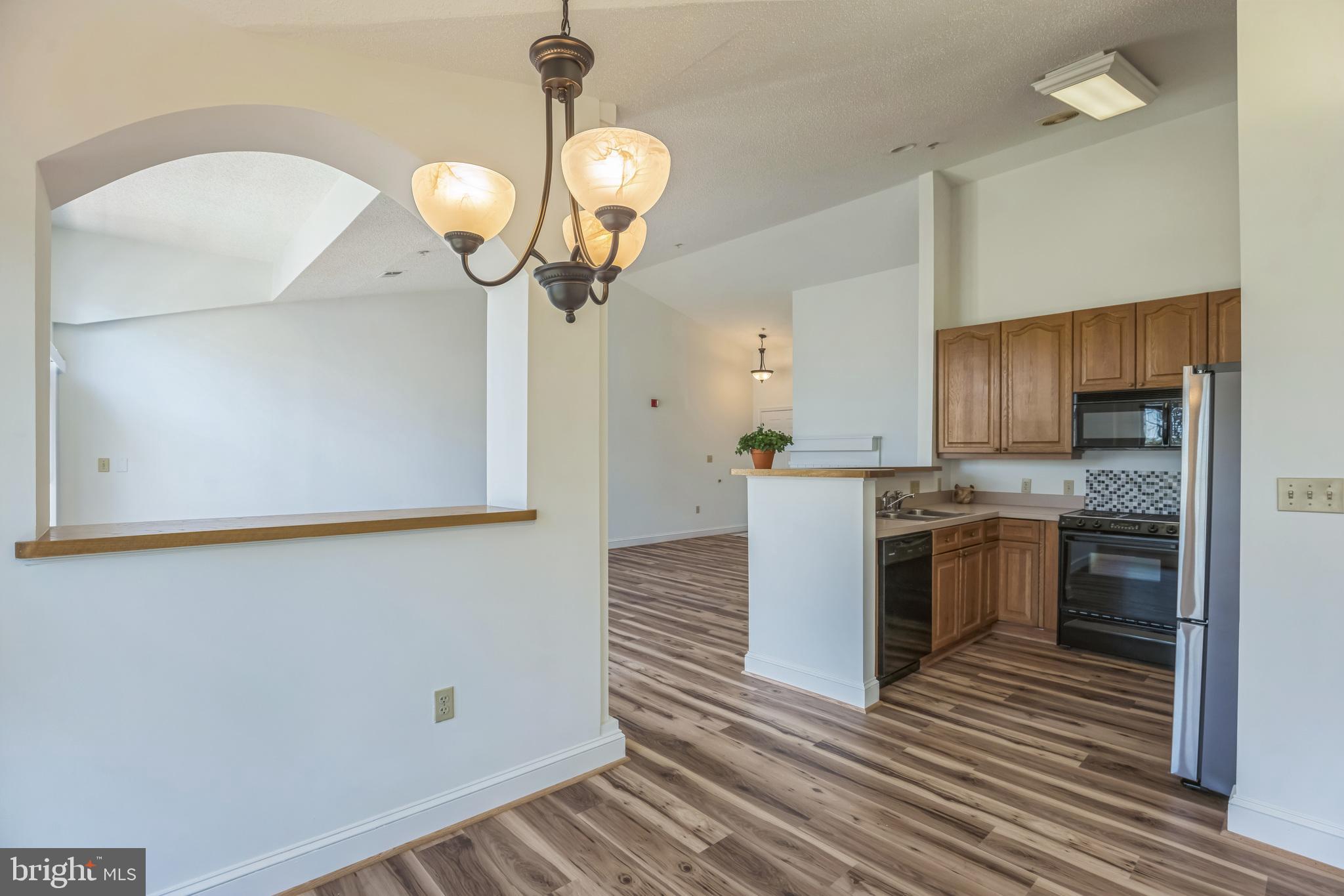 534 Runabout Loop, Unit 534 Solomons, MD 20688 - Photo 14 of 36 a kitchen with a sink and stainless steel appliances