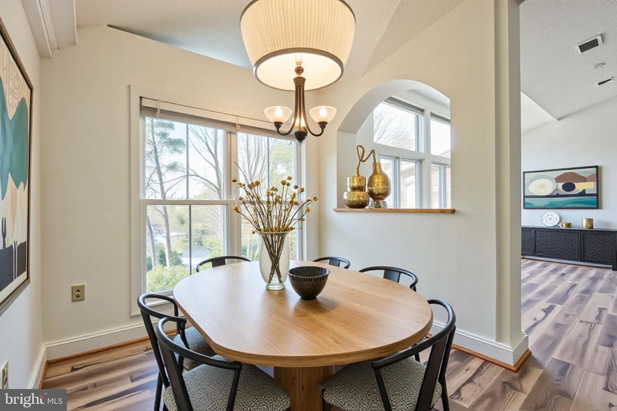 534 Runabout Loop, Unit 534 Solomons, MD 20688 - Photo 15 of 36 a view of a dining room with furniture and chandelier