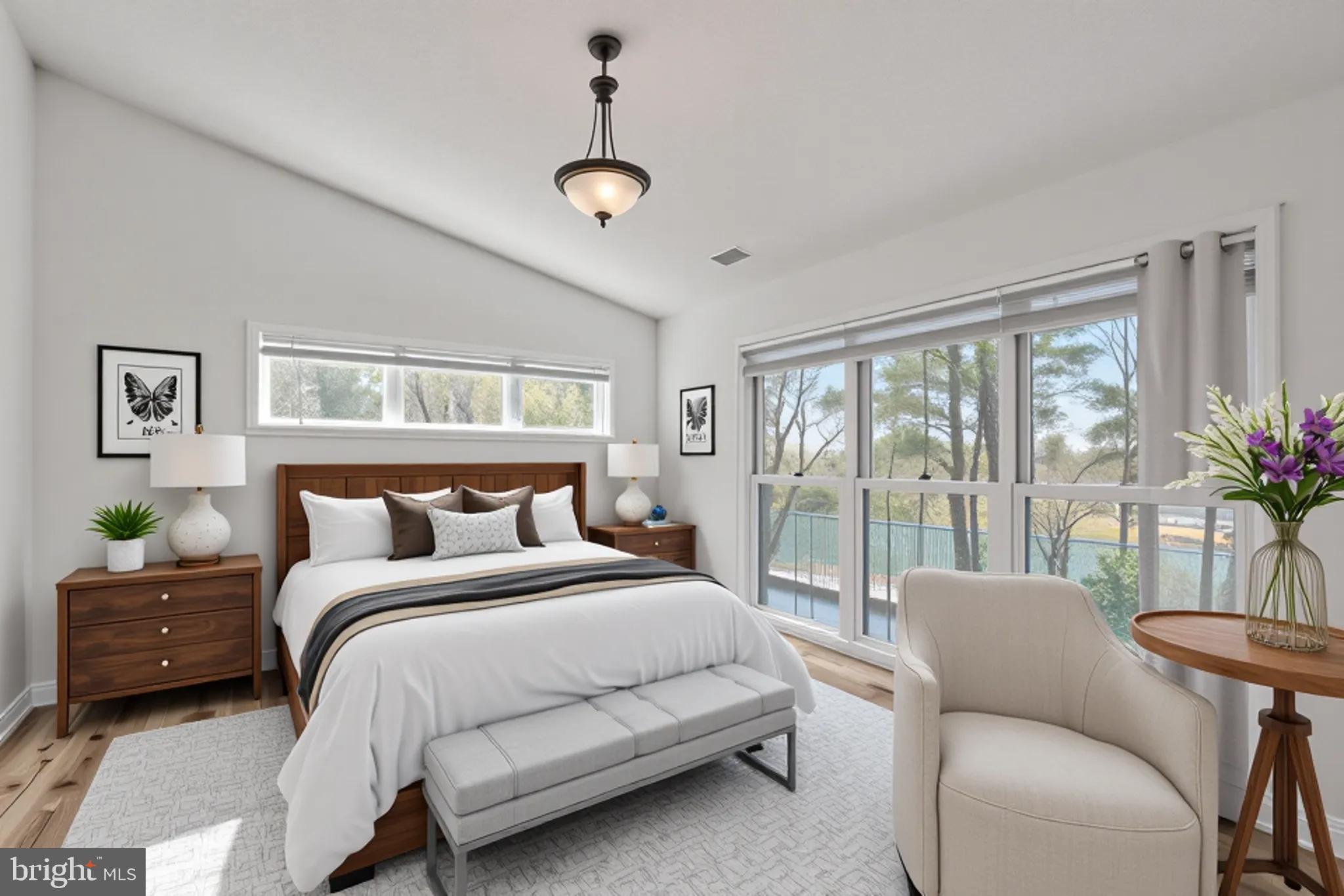 534 Runabout Loop, Unit 534 Solomons, MD 20688 - Photo 17 of 36 a bedroom with a balcony a bed and a couch