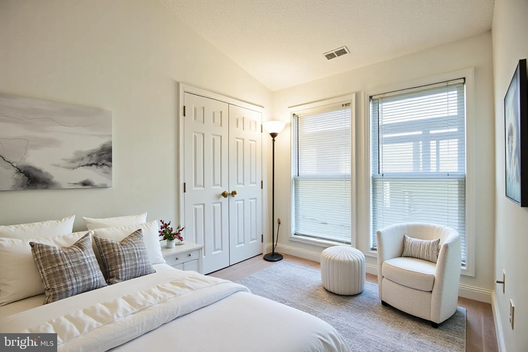 534 Runabout Loop, Unit 534 Solomons, MD 20688 - Photo 19 of 36 a bedroom with furniture and a large window