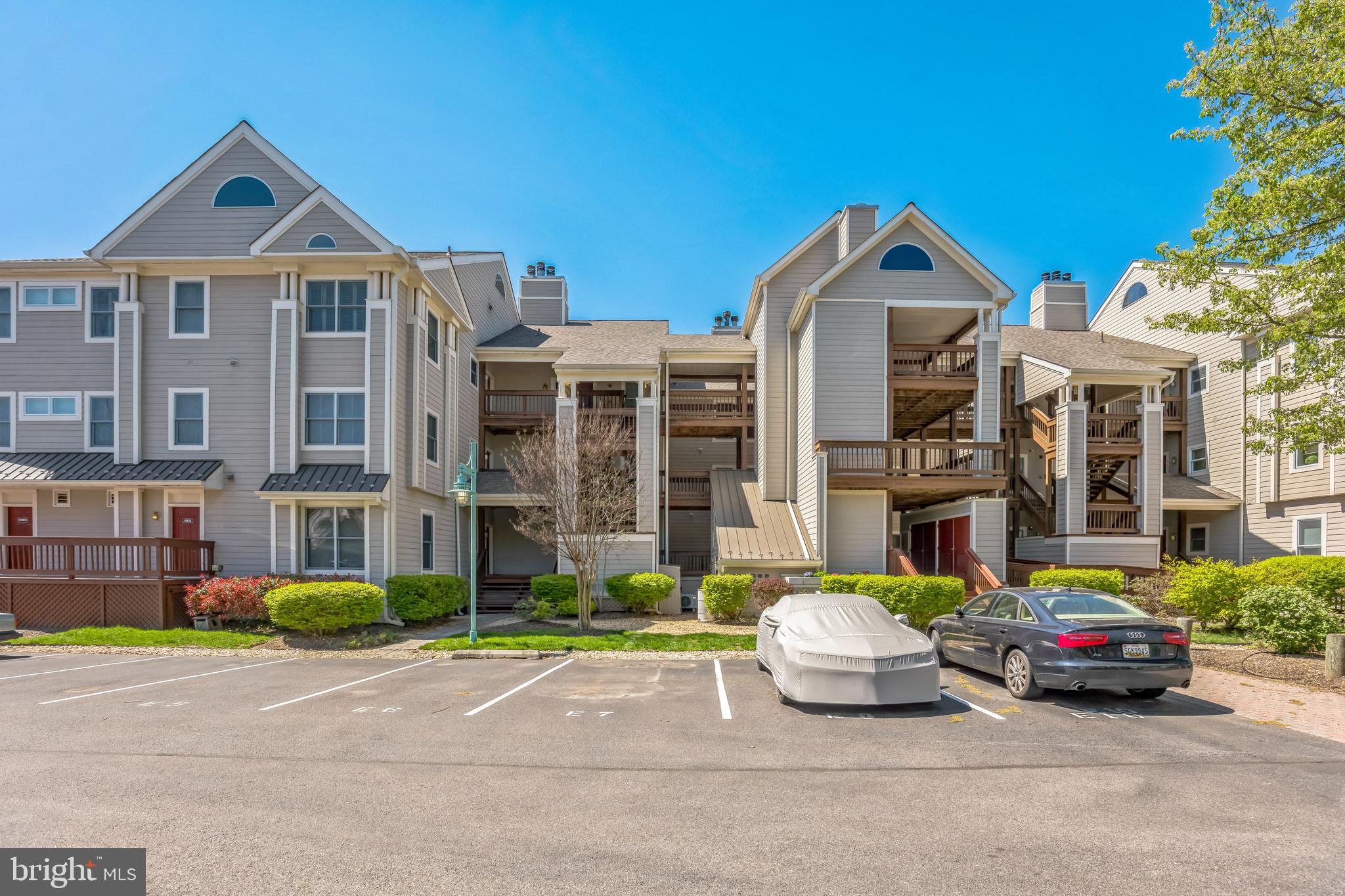 534 Runabout Loop, Unit 534 Solomons, MD 20688 - Photo 2 of 36 a front view of a building with cars parked