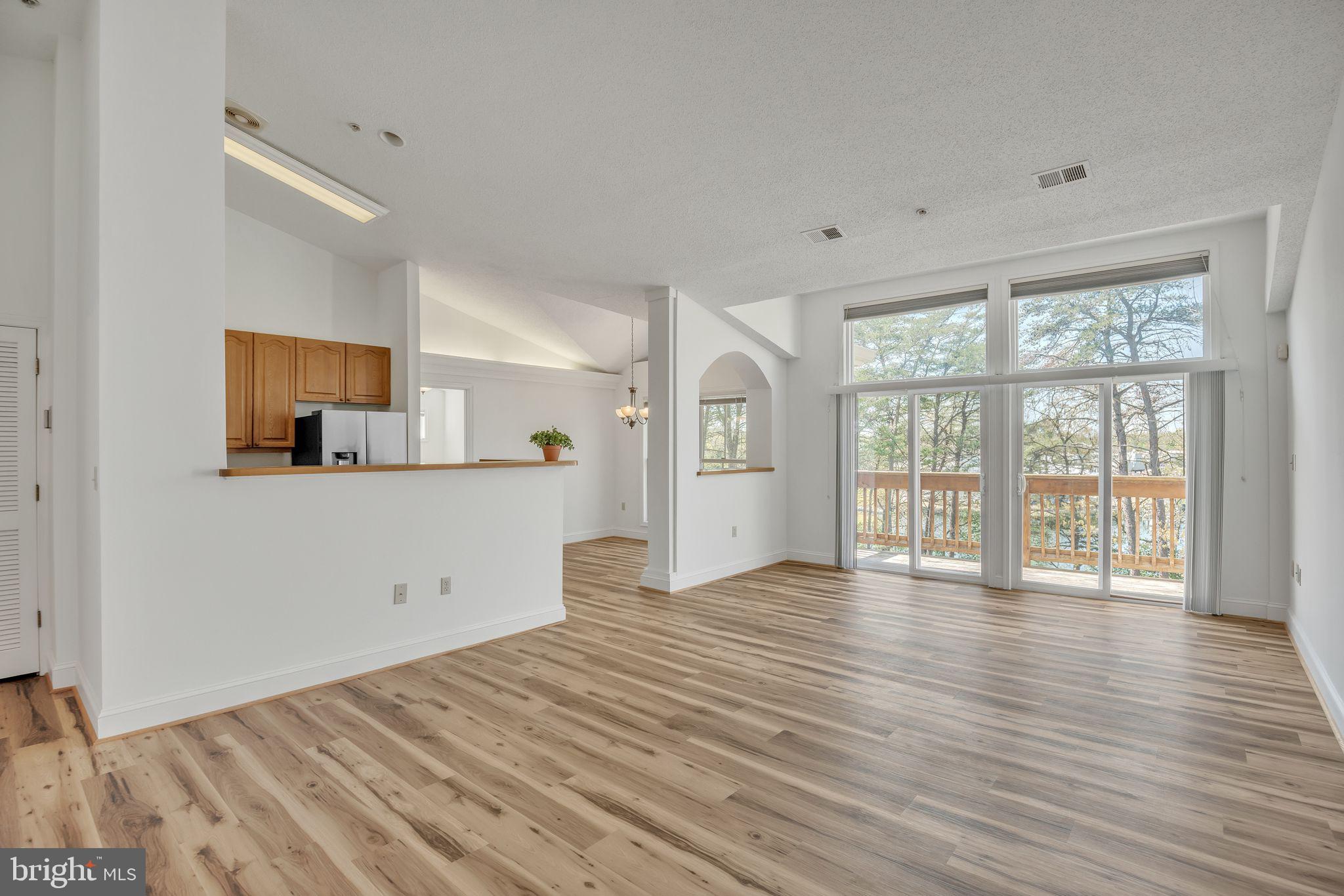 534 Runabout Loop, Unit 534 Solomons, MD 20688 - Photo 23 of 36 a view of a room with wooden floor and cabinet