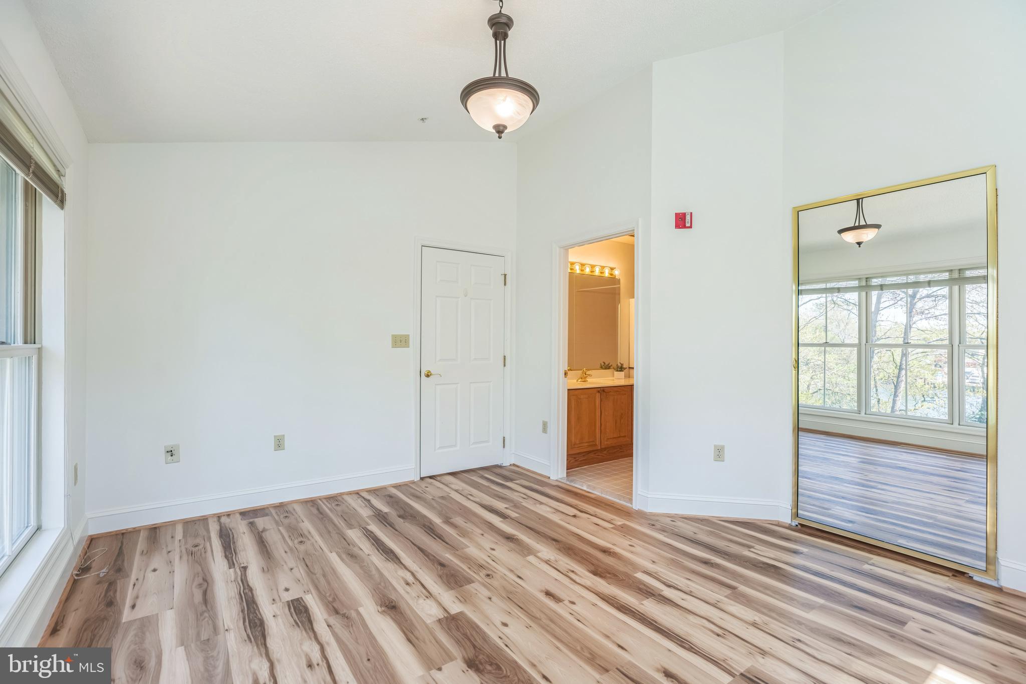 534 Runabout Loop, Unit 534 Solomons, MD 20688 - Photo 33 of 36 a view of empty room with wooden floor and fan