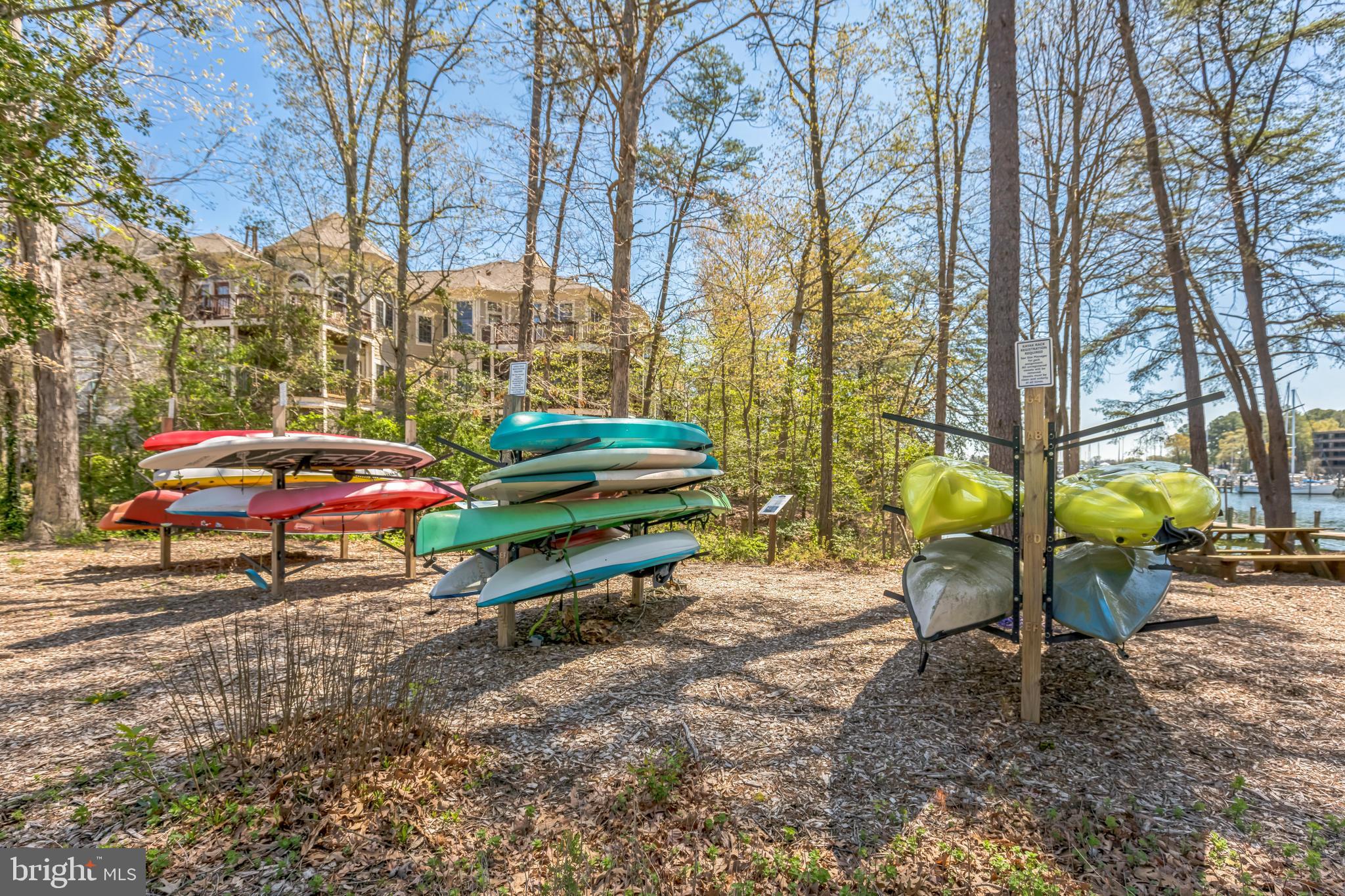 534 Runabout Loop, Unit 534 Solomons, MD 20688 - Photo 8 of 36 a backyard of a house with barbeque oven table and chairs