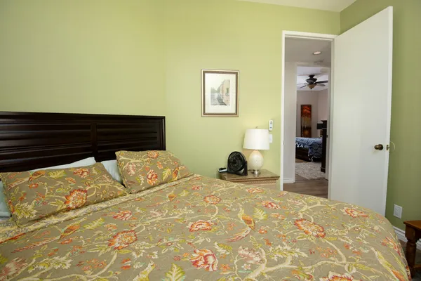 a bedroom with a bed and a view of bathroom