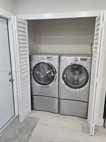a utility room with dryer and washer