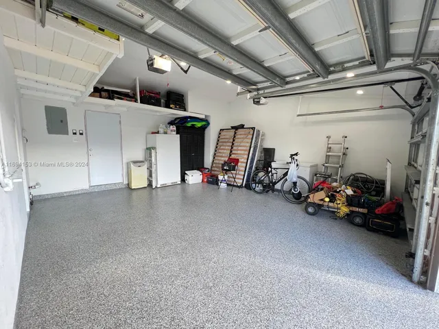 a view of a garage with parked cars