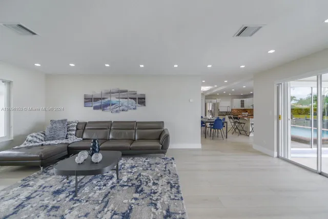 a living room with furniture and a table