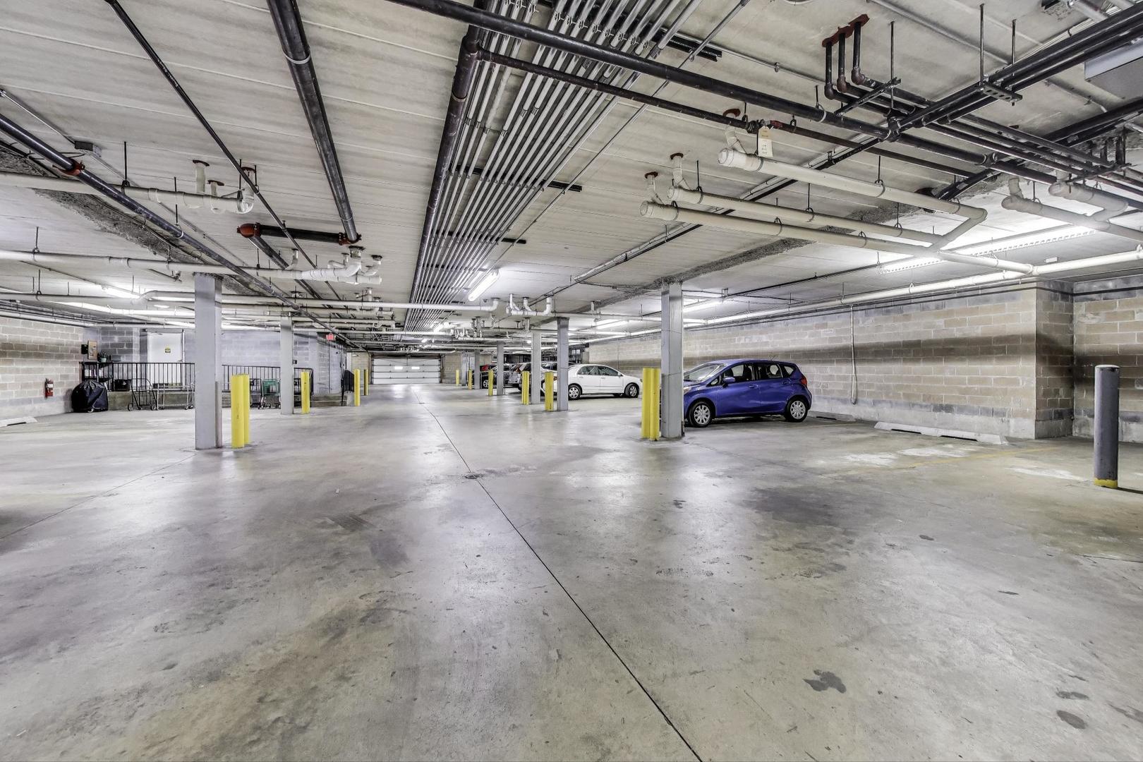 1200 South Prospect Avenue, Unit 108 Elmhurst, IL 60126 - Photo 18 of 19 a view of parking garage with lots of space