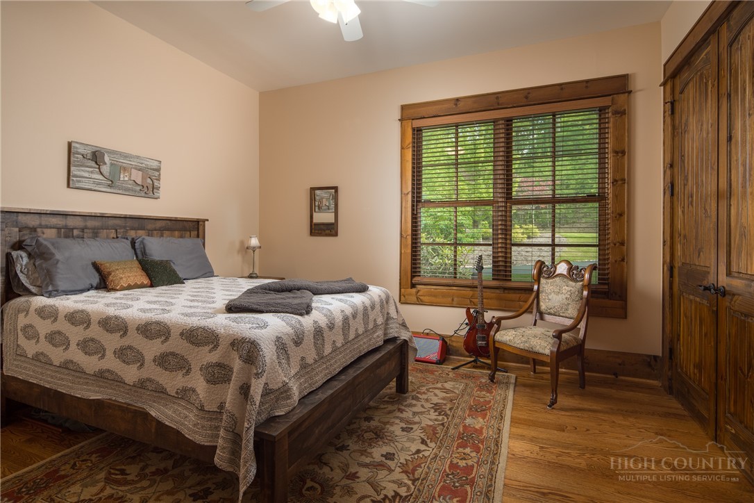 115 Passionflower Trail Boone, NC 28607 - Photo 27 of 50 a bedroom with a bed and a window