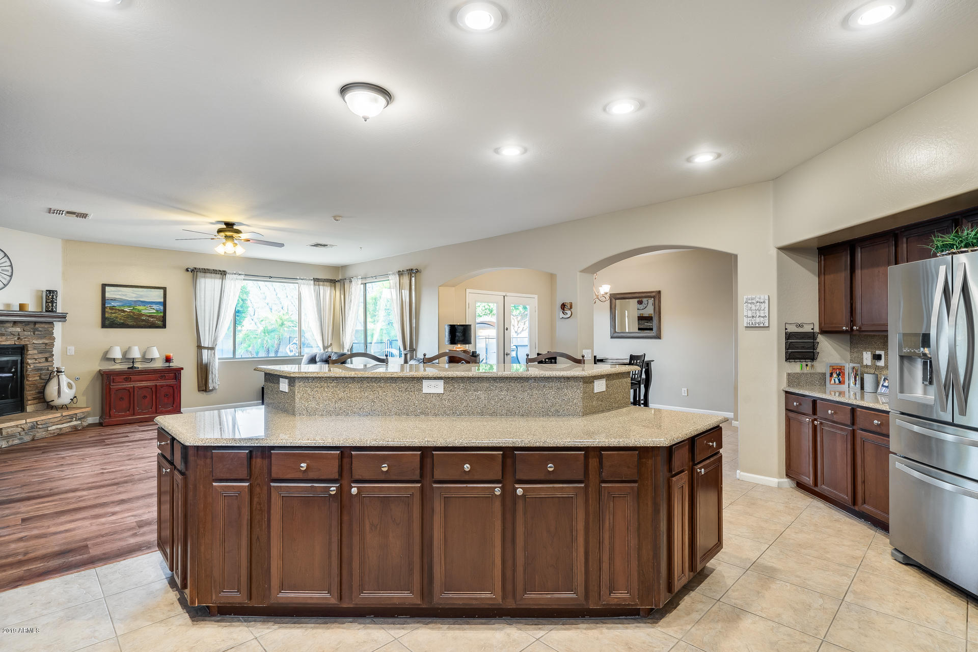 2028 West Caleb Road Phoenix, AZ 85085 - Photo 20 of 57 a dining hall with stainless steel appliances granite countertop a granite counter tops and a view of living room