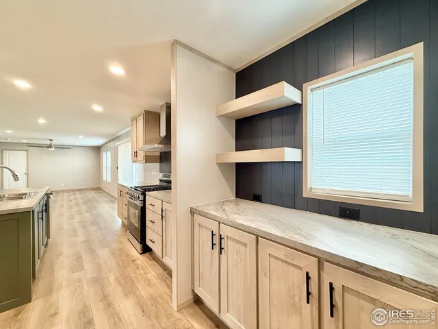 a kitchen with stainless steel appliances a stove and a refrigerator