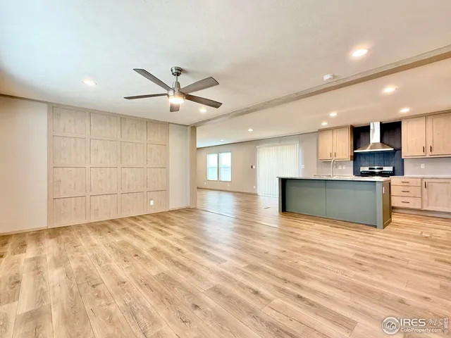 a view of kitchen with microwave and cabinets