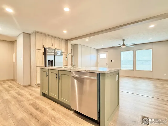 a view of a kitchen with electric appliances