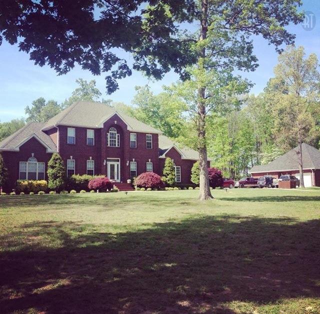 3350 Maxie Jones Road Springfield, TN 37172 - Photo 1 of 30 a front view of a house with a yard and a garage