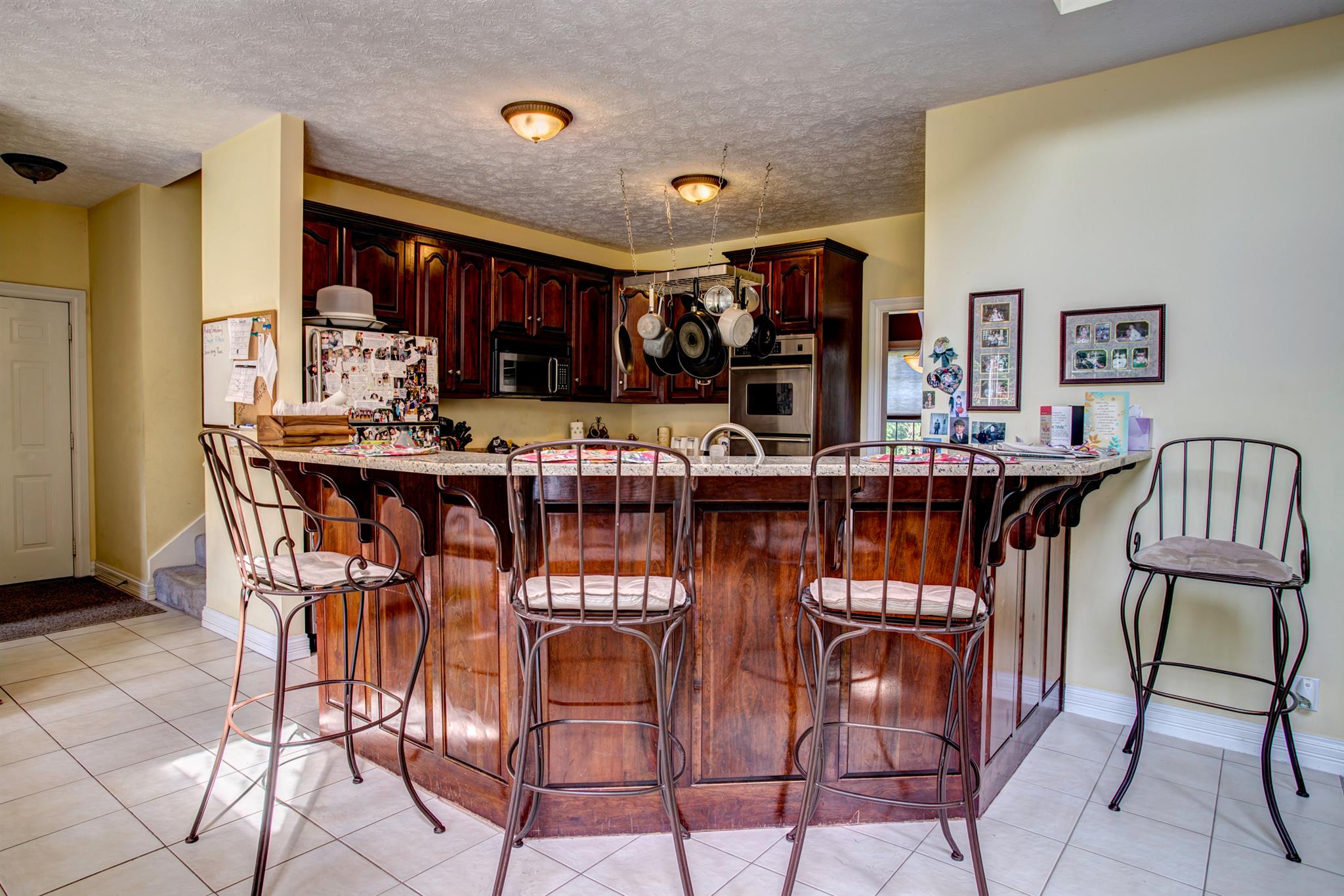 3350 Maxie Jones Road Springfield, TN 37172 - Photo 3 of 30 a dining hall with stainless steel appliances granite countertop a dining table and chairs