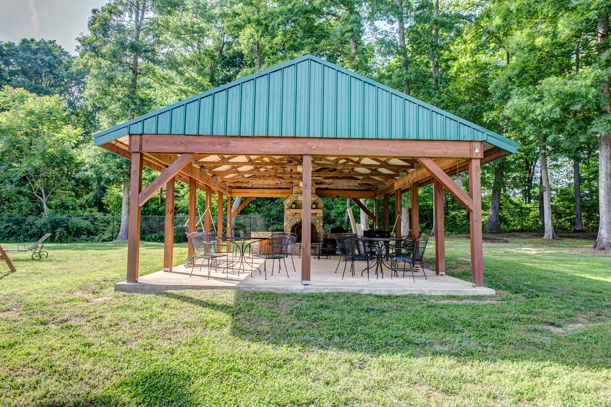 3350 Maxie Jones Road Springfield, TN 37172 - Photo 23 of 30 a view of a chair and table in backyard of the house