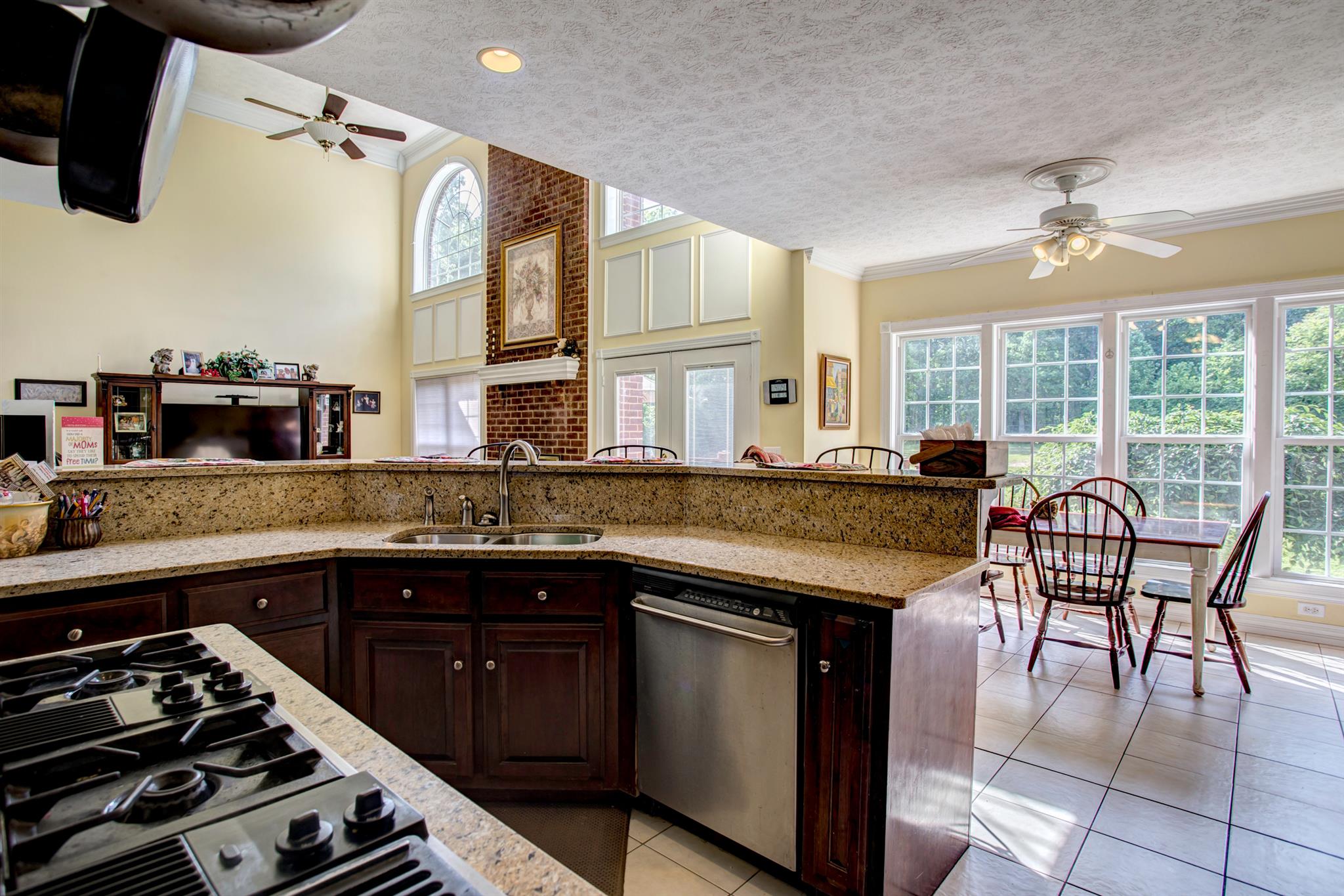 3350 Maxie Jones Road Springfield, TN 37172 - Photo 4 of 30 a kitchen with stainless steel appliances granite countertop a stove and a sink