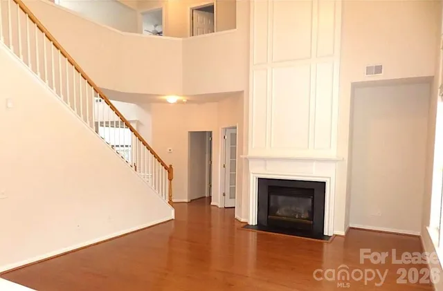 a view of a balcony with wooden floor