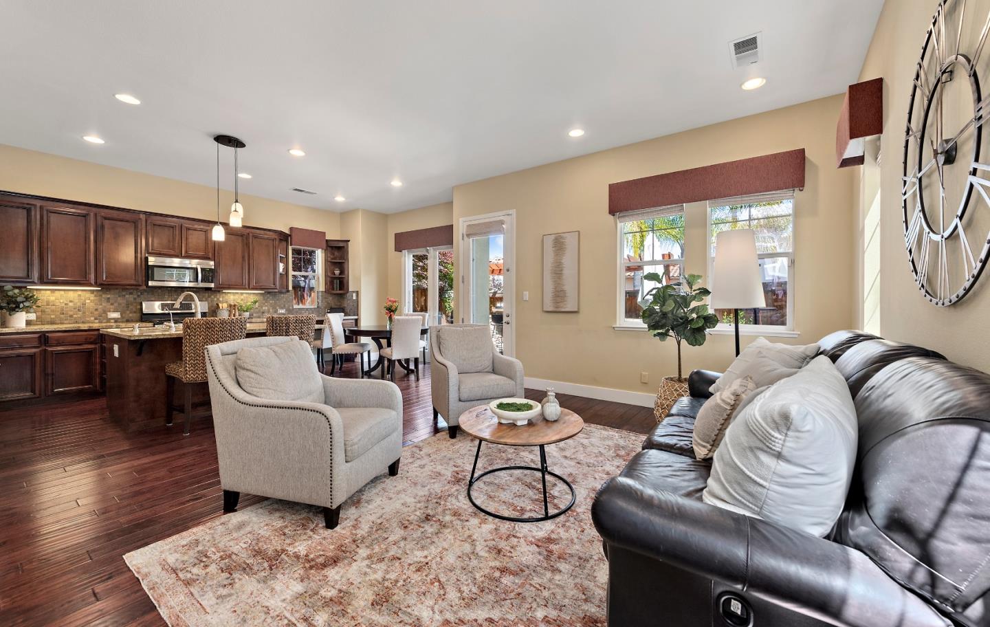7581 Edinburgh Way Gilroy, CA 95020 - Photo 11 of 38 a living room with furniture kitchen and a table