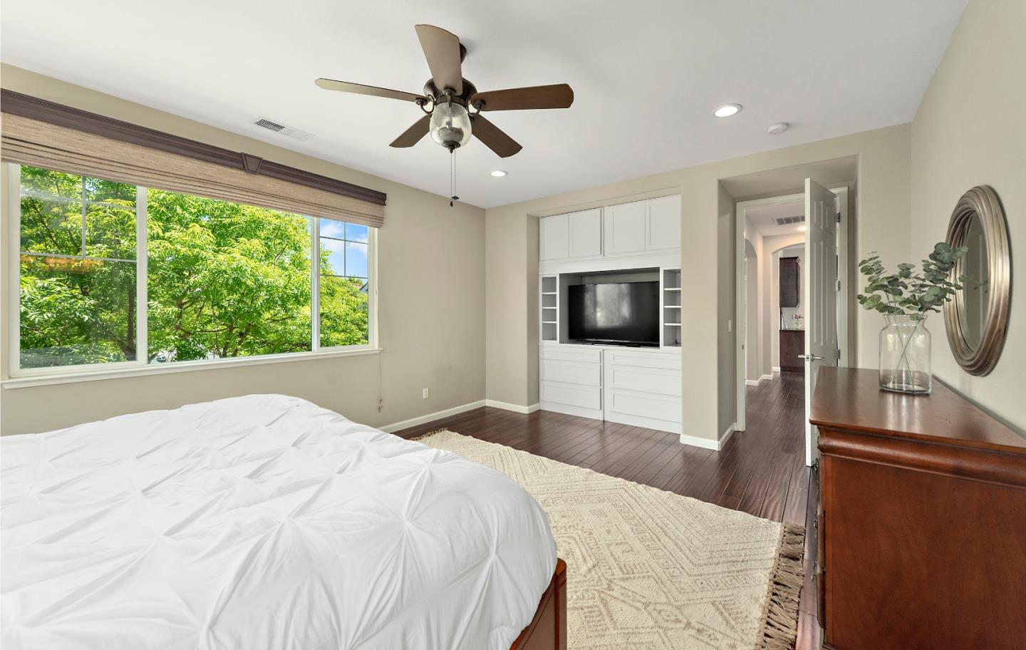 7581 Edinburgh Way Gilroy, CA 95020 - Photo 16 of 38 a bedroom with a large bed and a large window