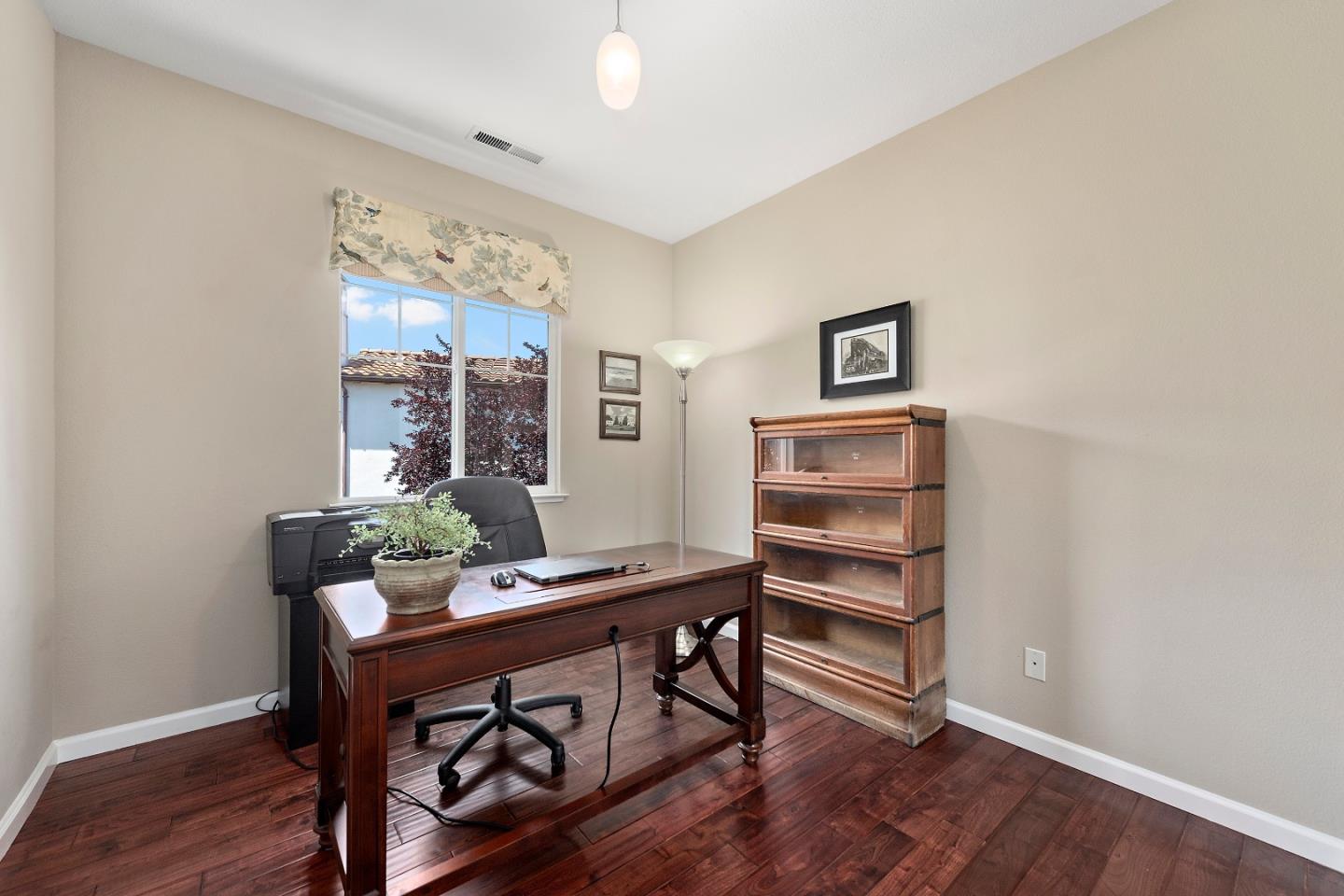 7581 Edinburgh Way Gilroy, CA 95020 - Photo 22 of 38 a room with furniture and wooden floor