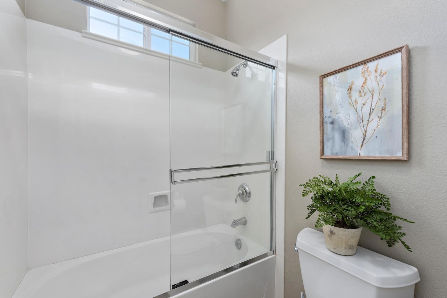 7581 Edinburgh Way Gilroy, CA 95020 - Photo 25 of 38 a bathroom with a shower a toilet and a shower