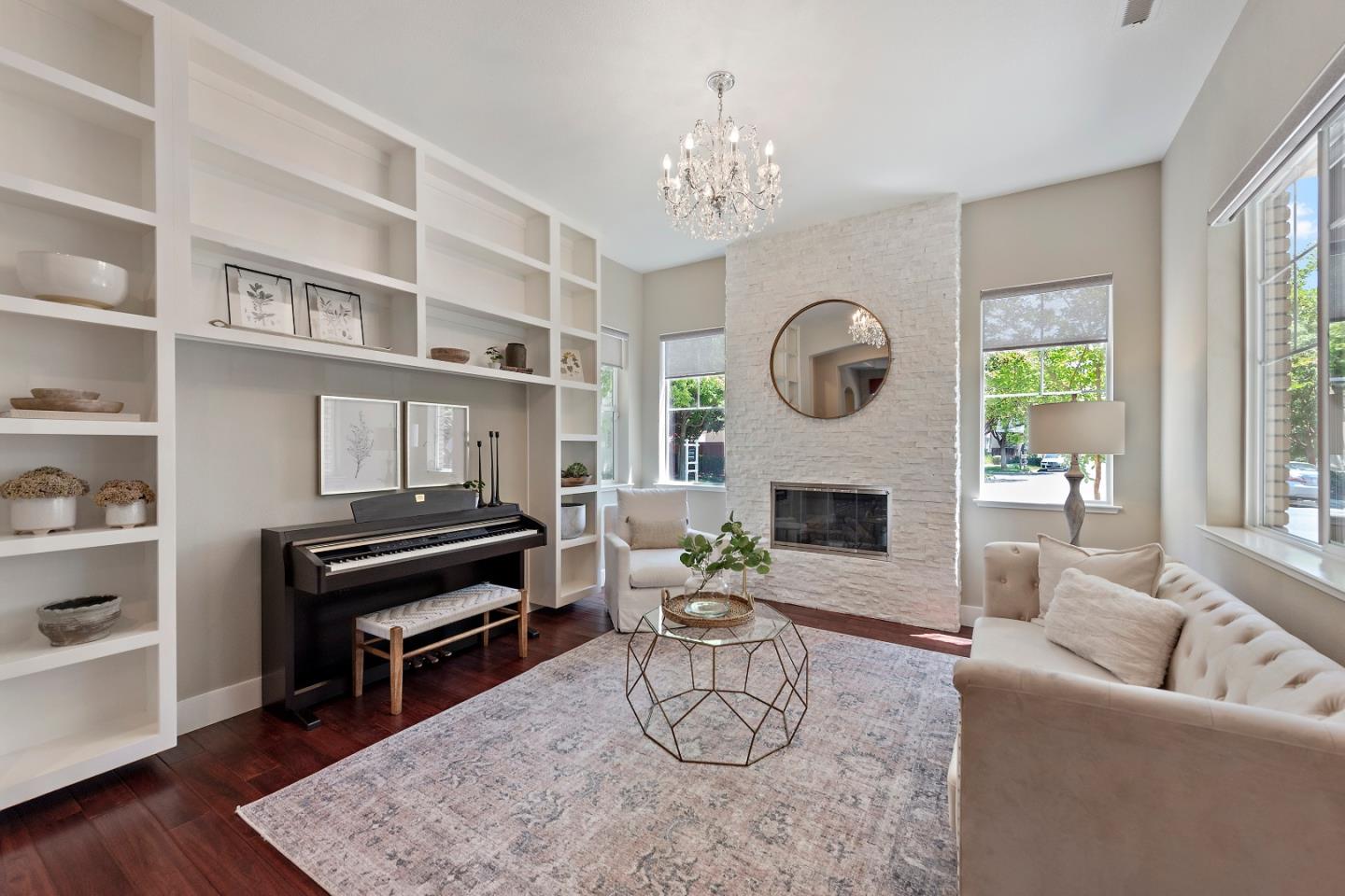 7581 Edinburgh Way Gilroy, CA 95020 - Photo 4 of 38 a living room with furniture a fireplace and a large window