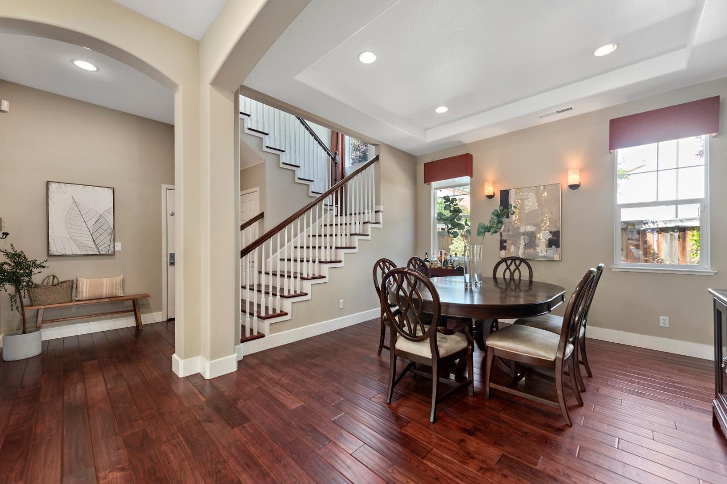 7581 Edinburgh Way Gilroy, CA 95020 - Photo 5 of 38 a view of a a dining room with furniture window and wooden floor