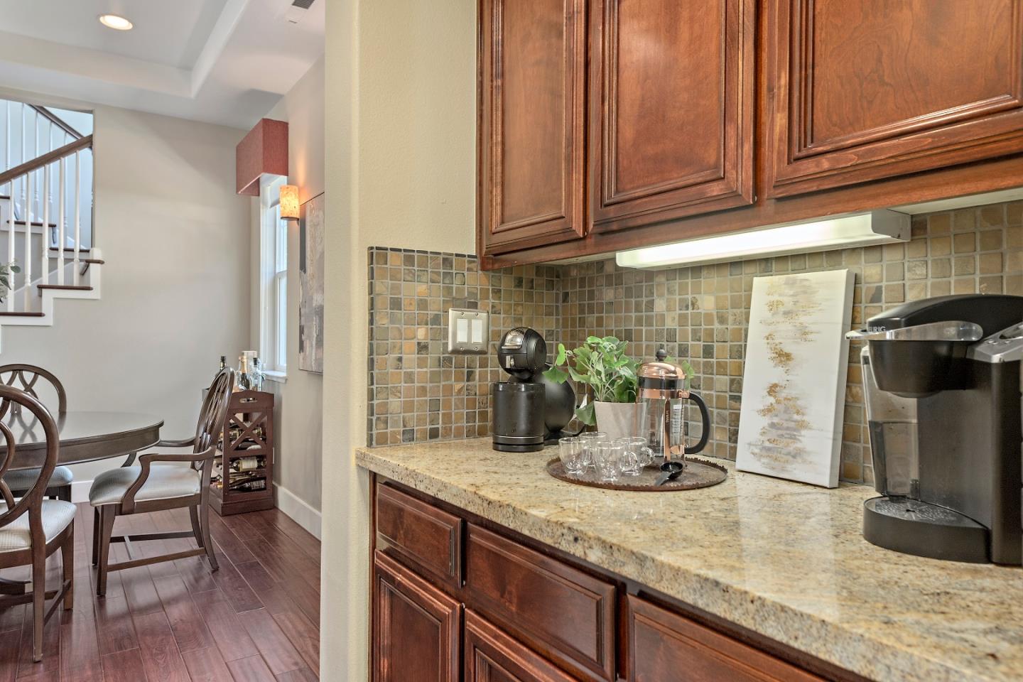 7581 Edinburgh Way Gilroy, CA 95020 - Photo 10 of 38 a kitchen with a refrigerator and a sink